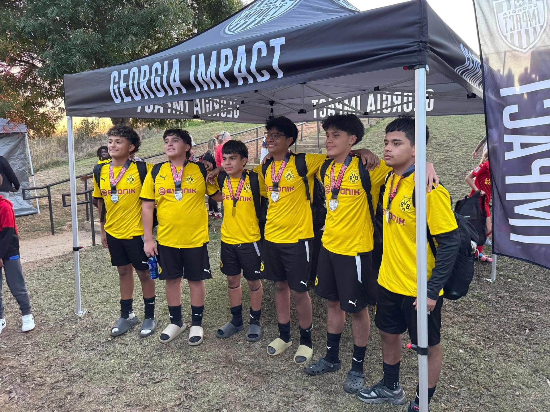 Finalist team under Georgia Impact tent