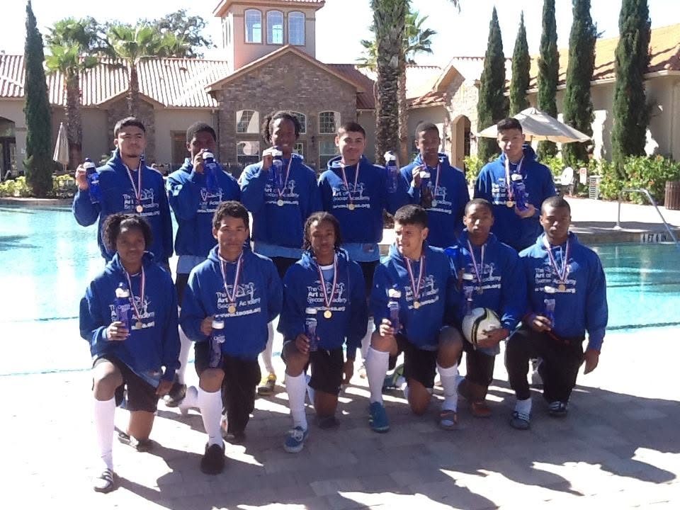 Tournament team with medals by the pool